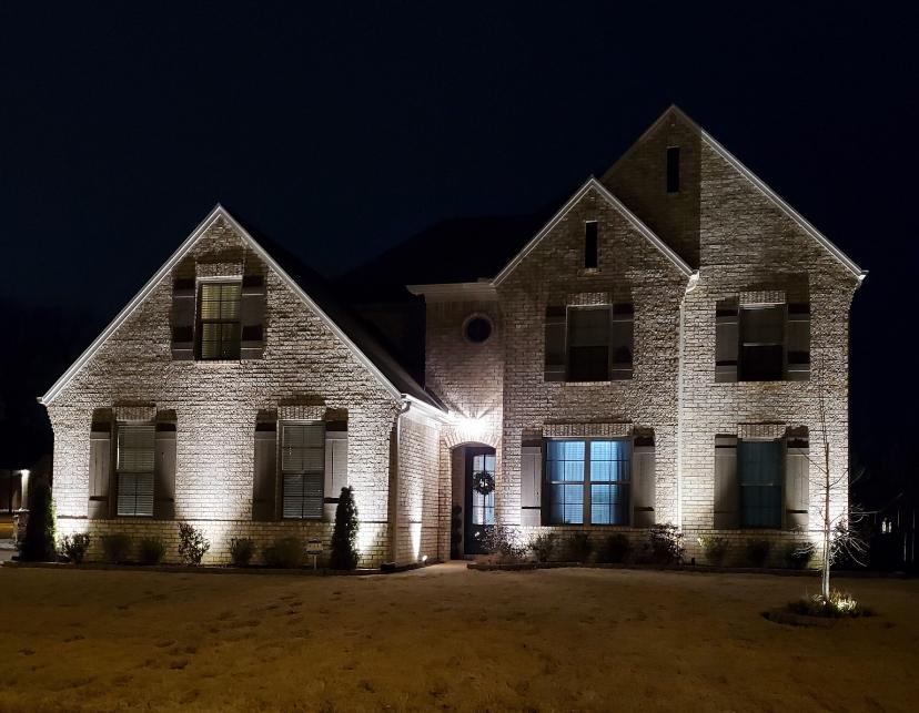 Custom landscape lighting installation on residential property in Tipton County