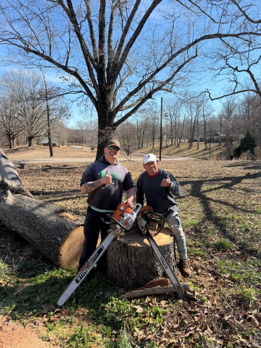 Outdoor Services Group crew with chainsaws ready for tree service work
